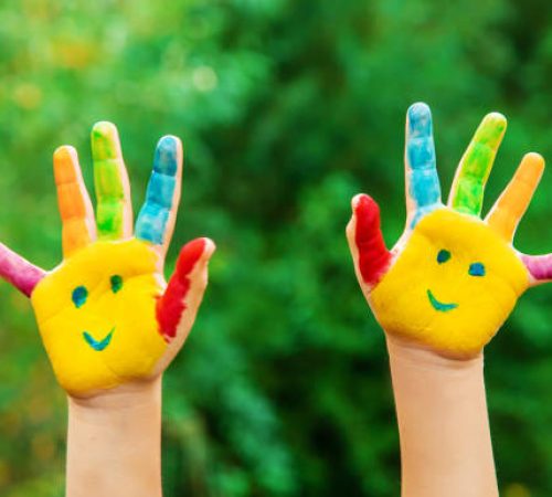 children hands in colors. Summer photo. Selective focus. nature children hands in colors. Summer photo. Selective focus. nature