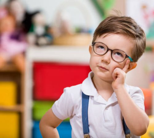 Little boy planning in classroom. Little boy planning in classroom.